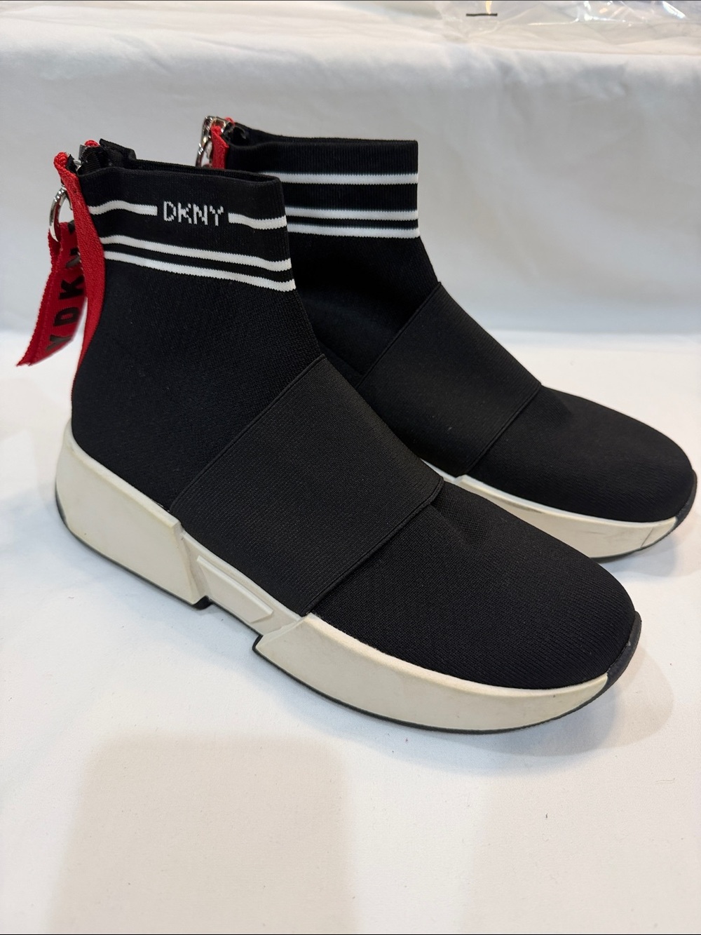 DKNY Black Knit Slip-On High-Top Sneakers with White Sole and Red Pull Tab